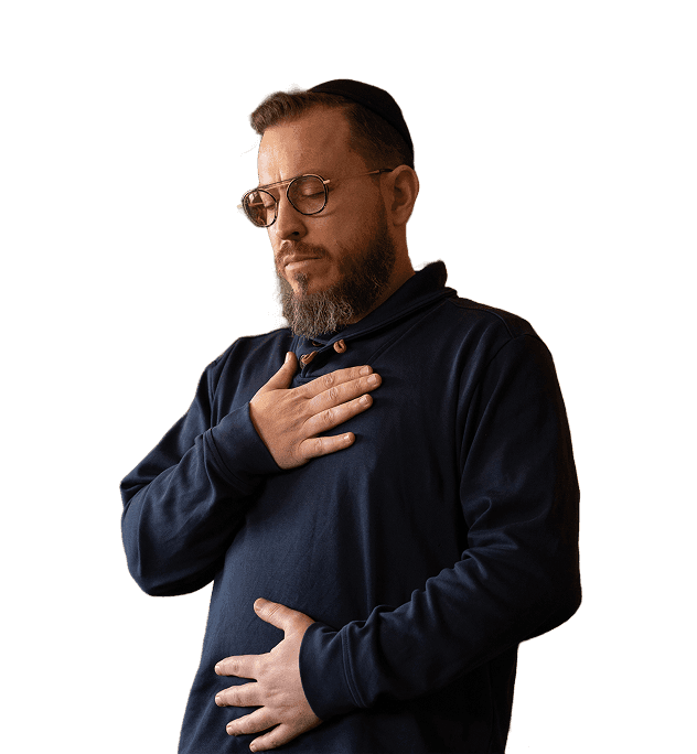 Chaim with his hand on his chest, breathing